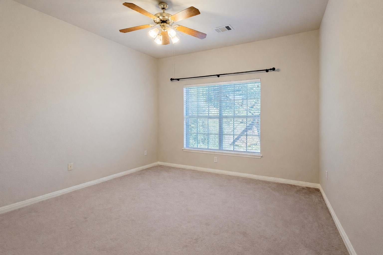 5515 Davis Lane, Unit 82 Austin, TX 78749 - Photo 16 of 20 an empty room with a window and a fan