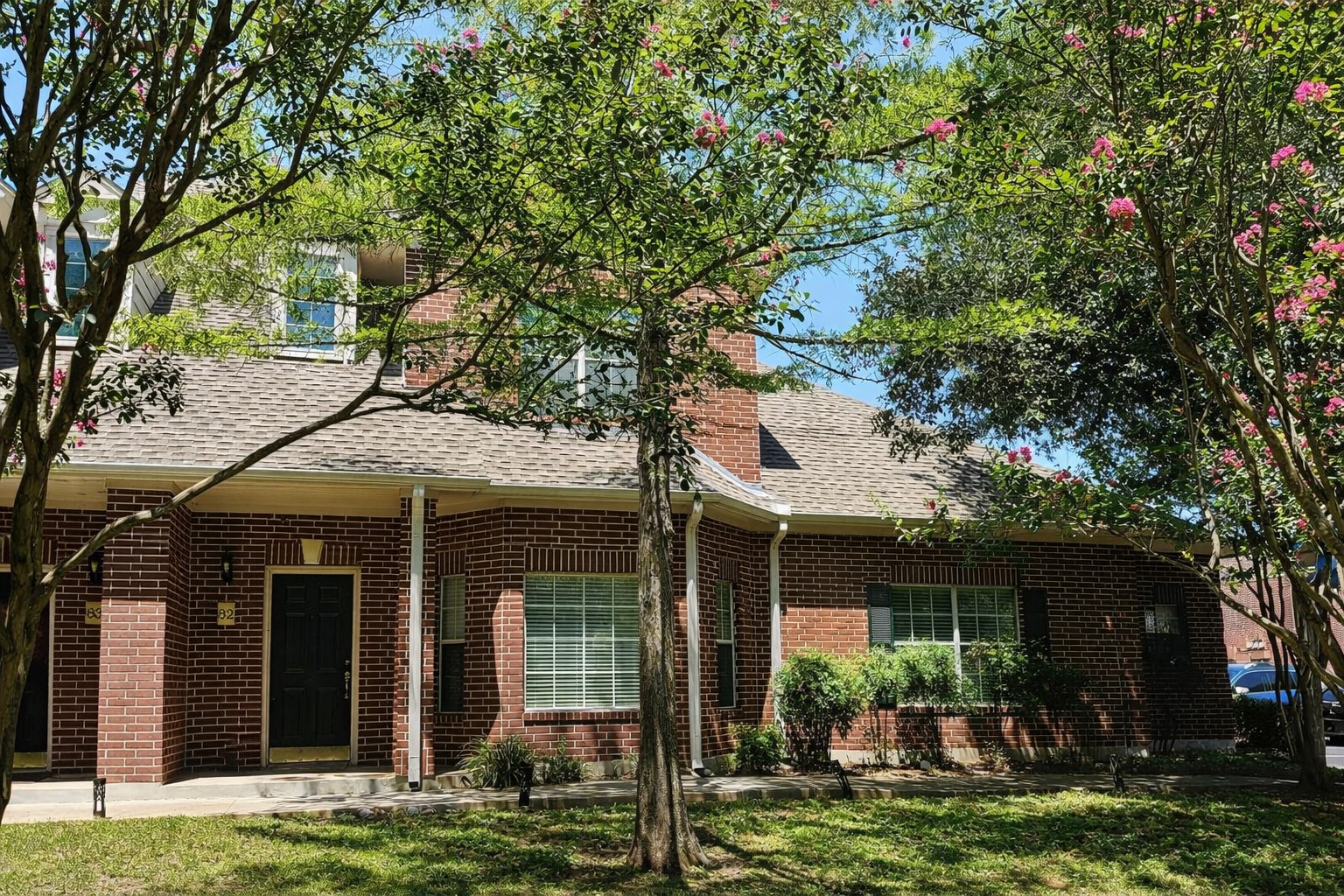 5515 Davis Lane, Unit 82 Austin, TX 78749 - Photo 3 of 20 a front view of a house with garden