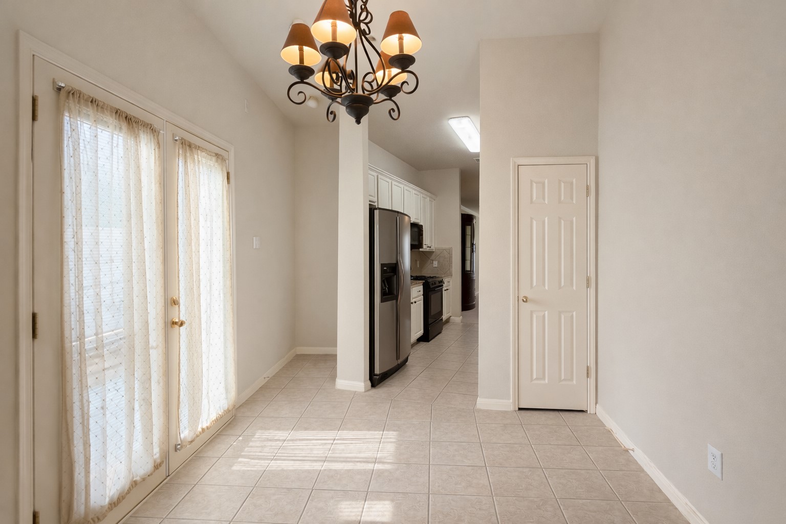 5515 Davis Lane, Unit 82 Austin, TX 78749 - Photo 9 of 20 a view of a hallway with a chandelier