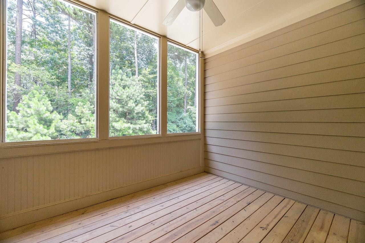 2033 Weston Green Loop Cary, NC 27513 - Photo 20 of 24 a view of empty room with wooden floor and fan