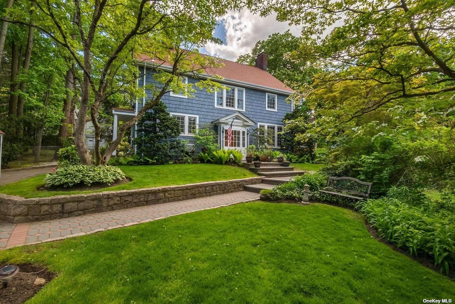 24 Redbrook Road Great Neck, NY 11024 - Photo 1 of 1 a view of a big house with a big yard and large trees
