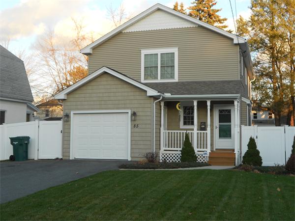 85 Dwight Road Springfield, MA 01108 - Photo 1 of 21 a front view of a house with a garden