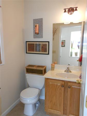 85 Dwight Road Springfield, MA 01108 - Photo 11 of 21 a bathroom with a toilet a sink and mirror