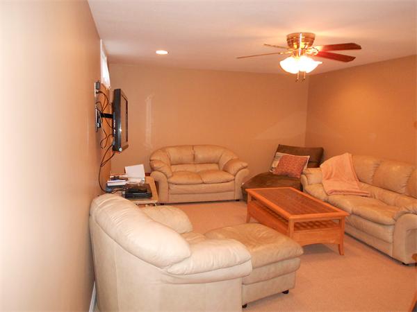 85 Dwight Road Springfield, MA 01108 - Photo 17 of 21 a bedroom with a bed and a chandelier