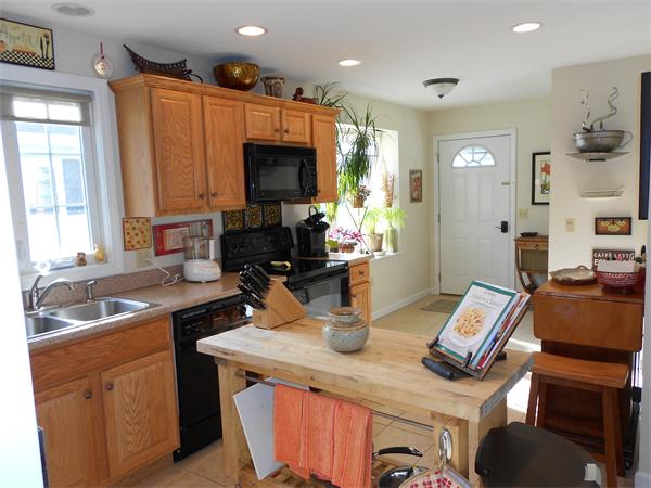 85 Dwight Road Springfield, MA 01108 - Photo 5 of 21 a kitchen with a sink stove and cabinets