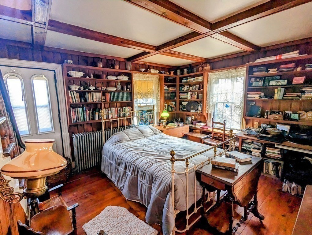 75 Marsh Road Dudley, MA 01571 - Photo 19 of 41 a bedroom with a bed and a table