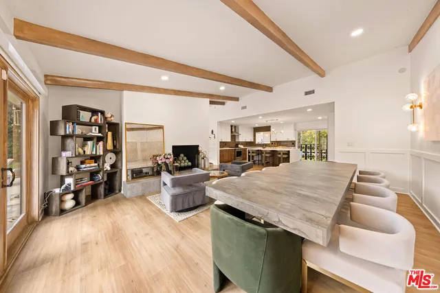 a view of a house with swimming pool and sitting area