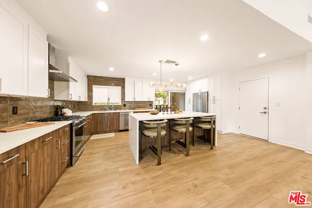 a bedroom with furniture and a lamp