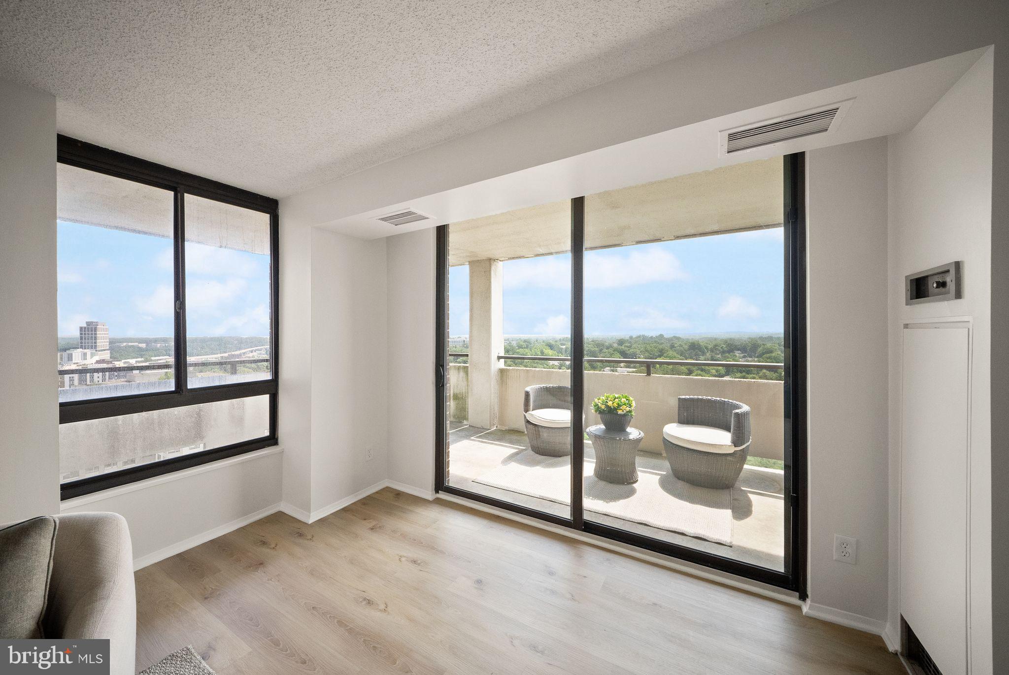 1800 Old Meadow Road, Unit 1601 McLean, VA 22102 - Photo 11 of 46 Exit to balcony from Living Room