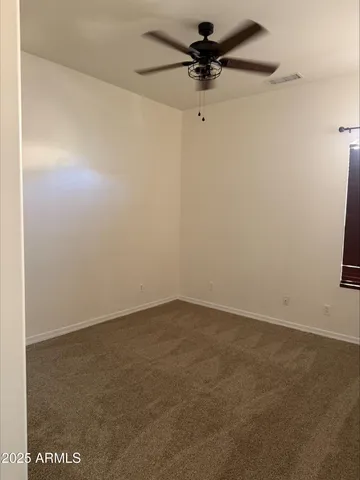 a bathroom with a granite countertop toilet and a sink