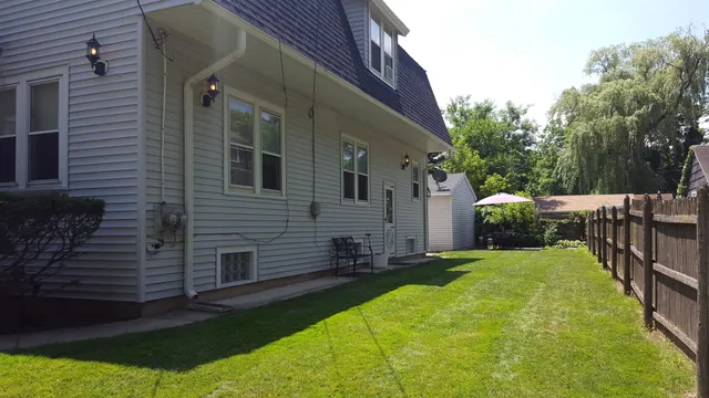 a view of a back yard of the house