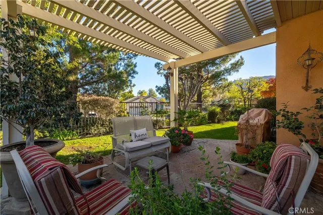 a view of a backyard with large trees