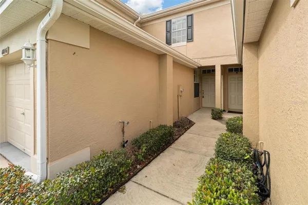 a picture of a house with a small yard