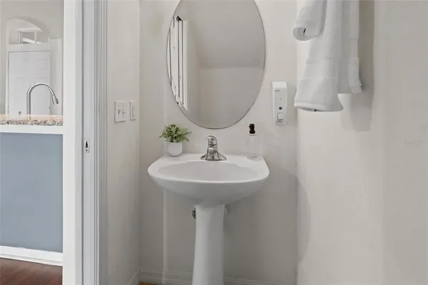 a bathroom with a sink and a mirror
