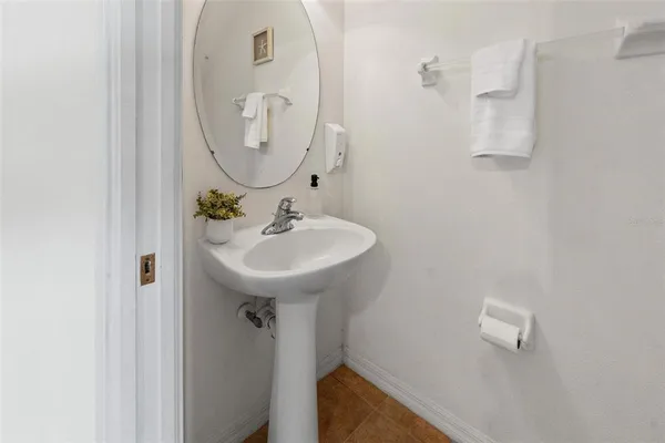 a bathroom with a sink and mirror