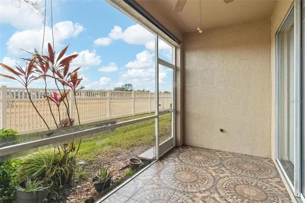 a front view of a building with a garden