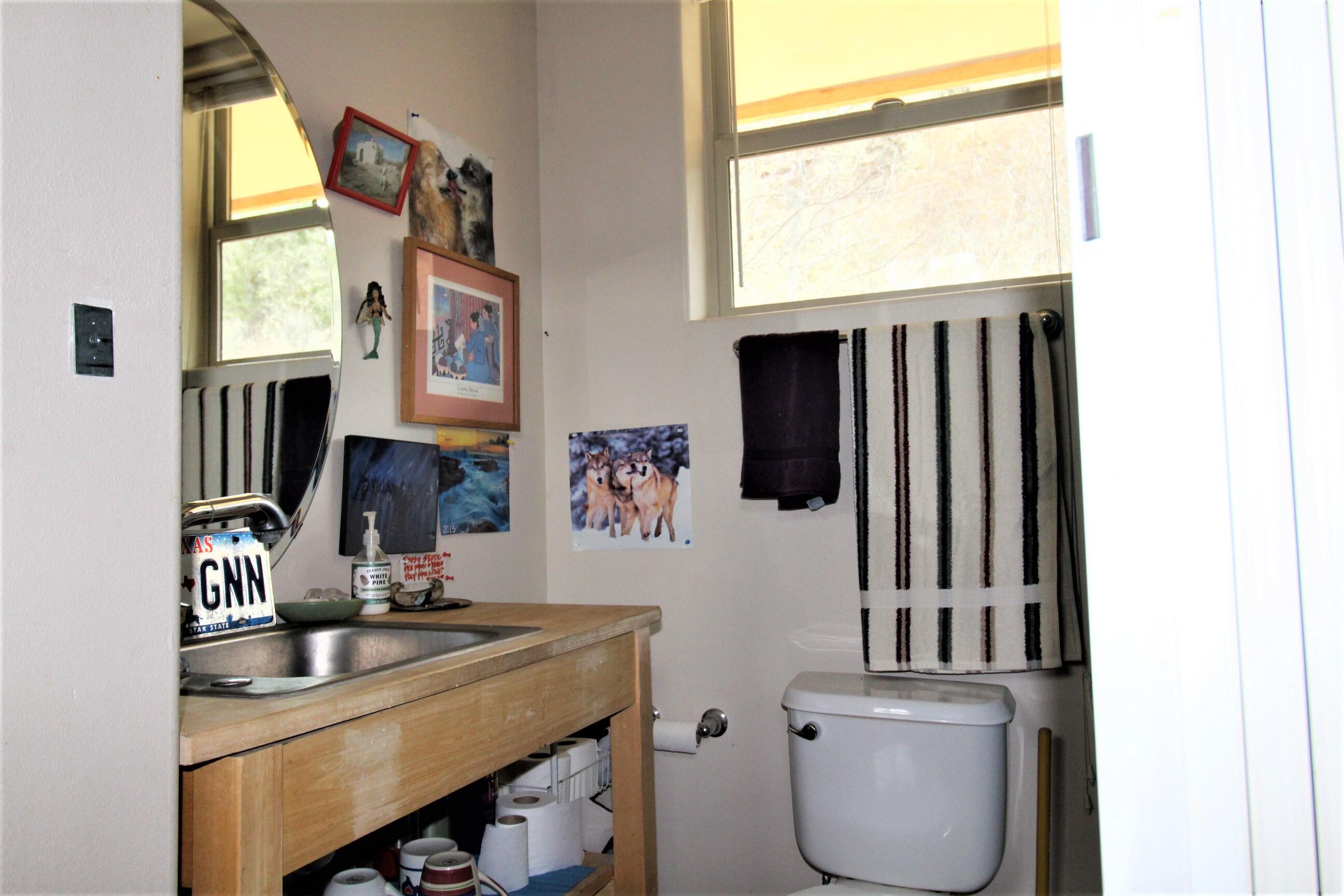 2200 Little Applegate Road Jacksonville, OR 97530 - Photo 26 of 39 a room with furniture a window and a potted plant