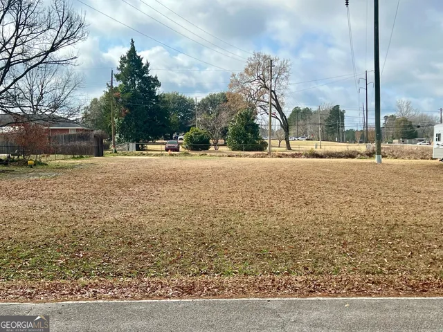 a swimming pool with outdoor seating and yard