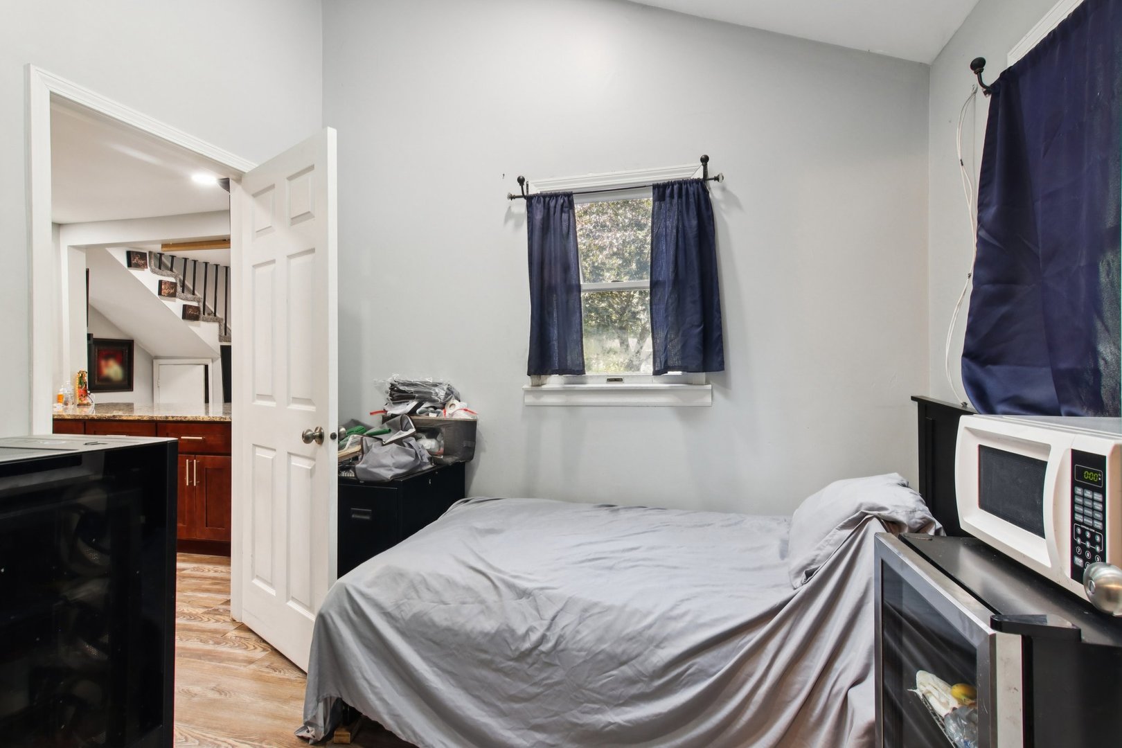 806 Spencer Street Joliet, IL 60433 - Photo 15 of 49 a bedroom with a bed and a television