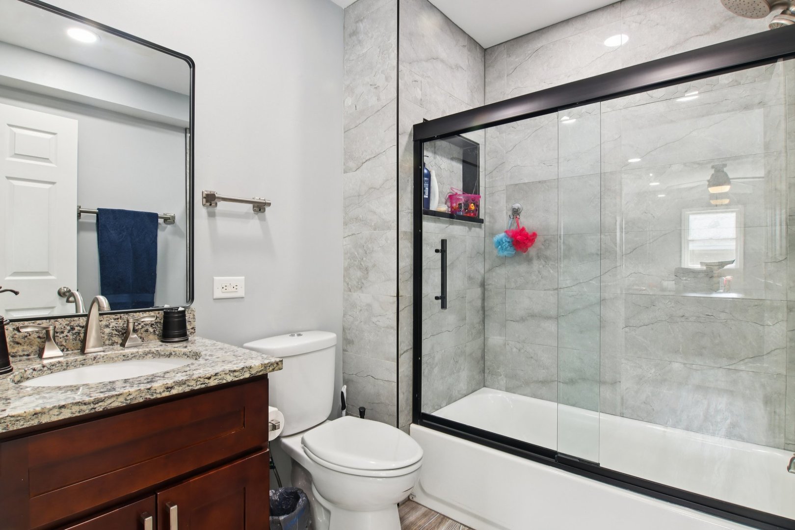 806 Spencer Street Joliet, IL 60433 - Photo 18 of 49 a bathroom with a granite countertop sink a toilet and shower