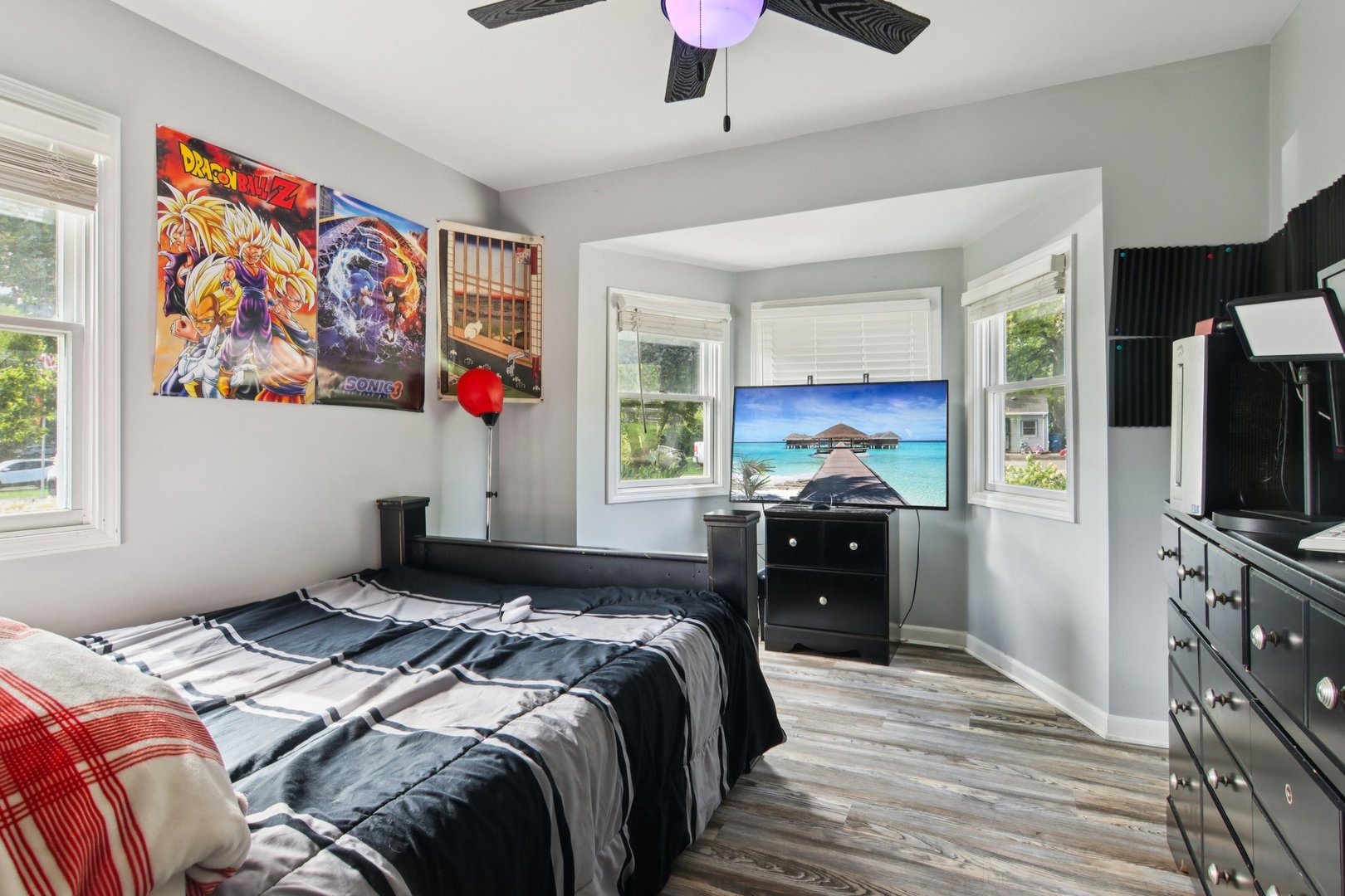 806 Spencer Street Joliet, IL 60433 - Photo 19 of 49 a bedroom with a bed and a flat screen tv