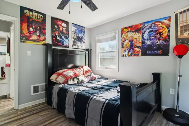 a living room with lots of furniture and wooden floor