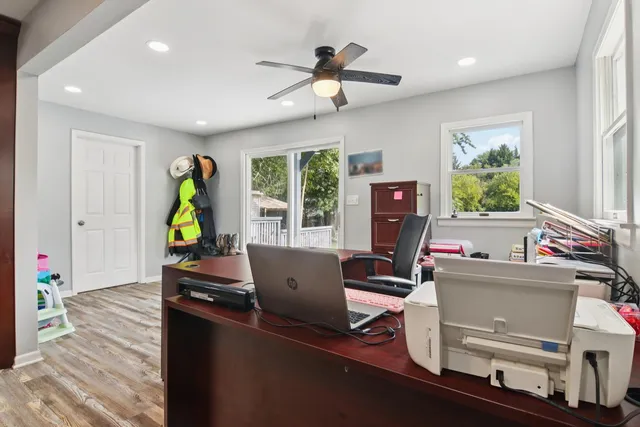 a bedroom with a bed and a desk