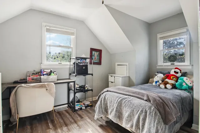 a view of a livingroom with furniture and floor to ceiling window