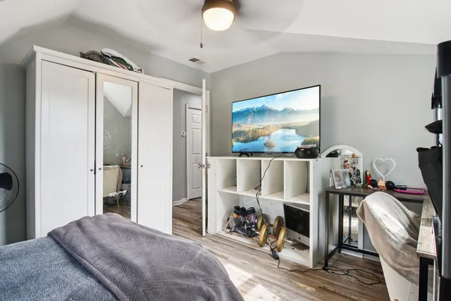 a bedroom with furniture and a window