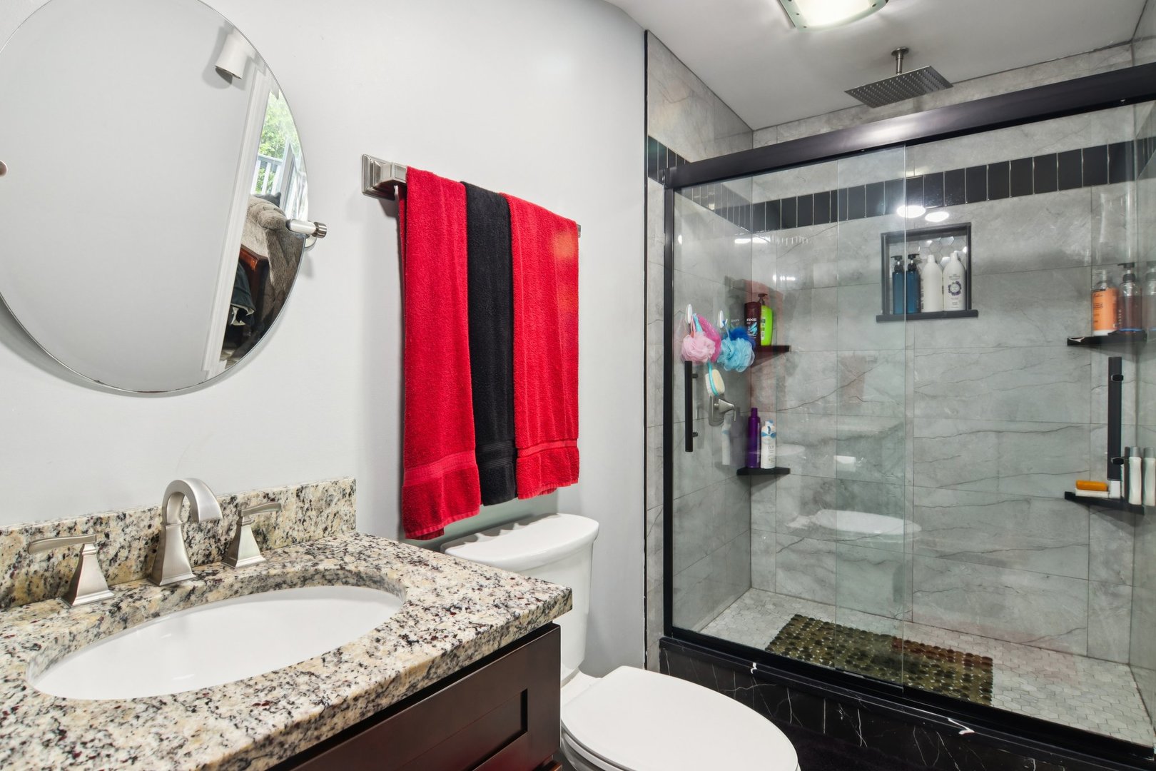 806 Spencer Street Joliet, IL 60433 - Photo 28 of 49 a bathroom with a granite countertop sink a toilet and shower
