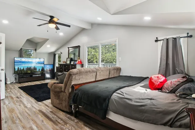 a bed room with furniture and a window