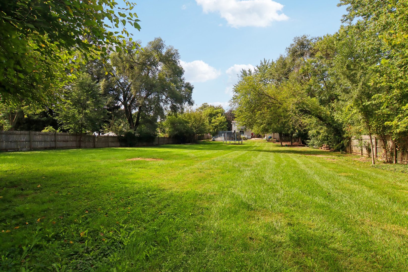806 Spencer Street Joliet, IL 60433 - Photo 40 of 49 a view of outdoor space with deck and trees