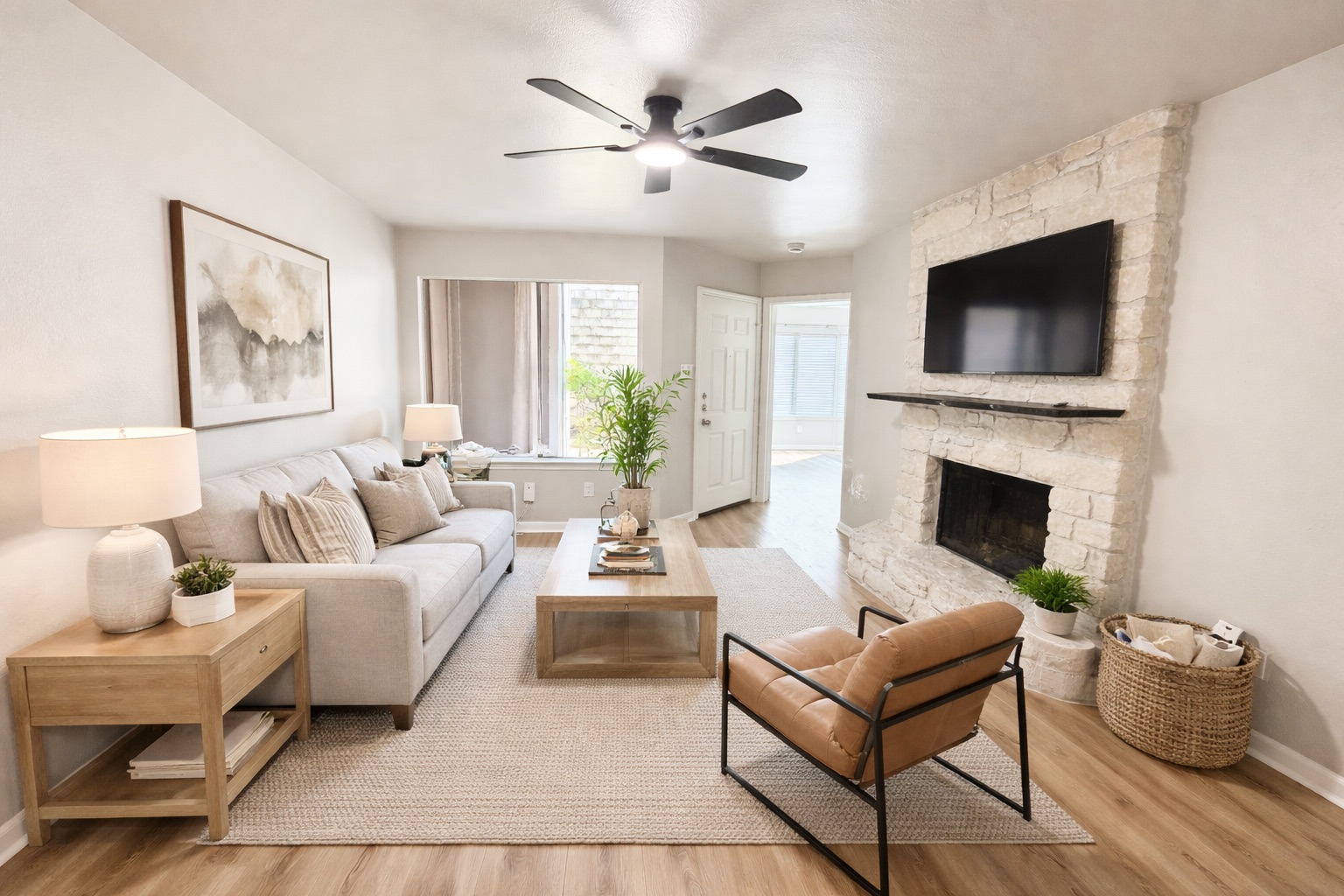 1730 Timber Ridge Road, Unit 152 Austin, TX 78741 - Photo 12 of 26 Living room featuring a fireplace, light wood-style floors, and ceiling fan