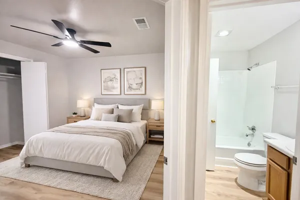 a bedroom with a bed and a view of bathroom