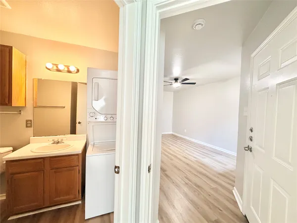 a bathroom with a sink a mirror and a shower