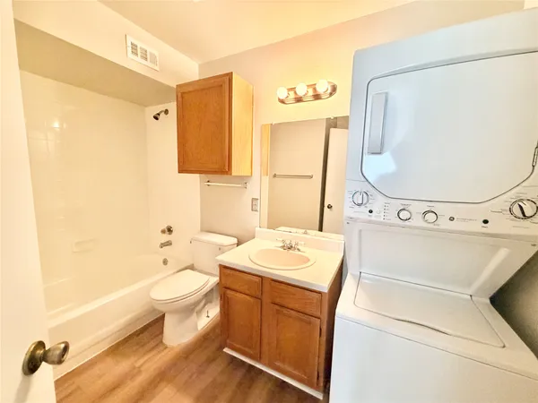 a bathroom with a sink toilet and tub
