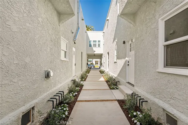 a front view of a building with a yard