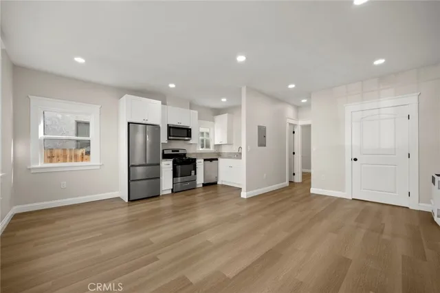 a view of kitchen with stainless steel appliances refrigerator oven