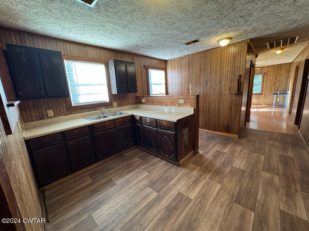 521 Shady Grove Road Denmark, TN 38391 - Photo 8 of 25 a kitchen with a sink a window and wooden floor