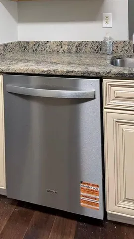 a view of room with granite countertop