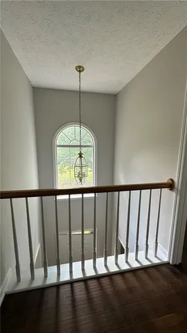 a view of staircase with a window