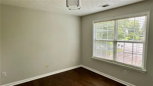 a view of a room with a large window