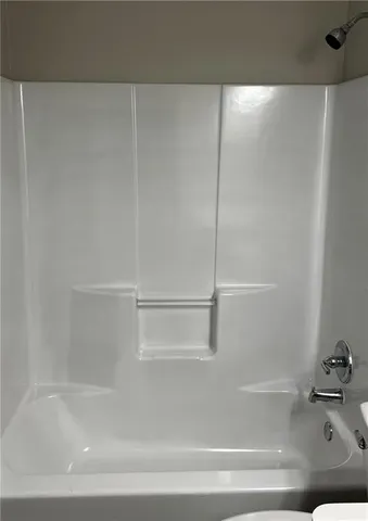 a close view of a bathtub in bathroom