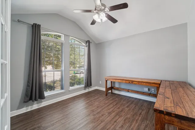a view of workspace with furniture and window