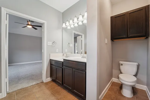 a view of a patio with a table chairs and a yard