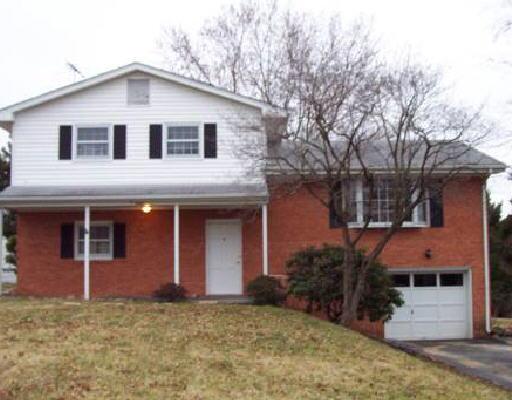 7601 Deer Branch Road Roanoke, VA 24019 - Photo 1 of 1 a front view of a house with a yard