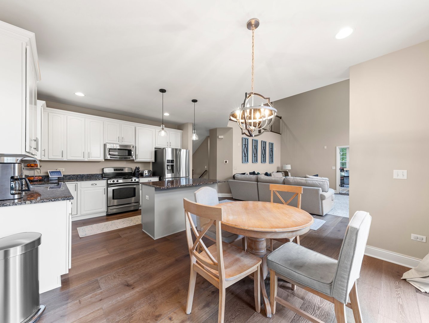 26305 Mapleview Drive Plainfield, IL 60585 - Photo 12 of 40 a view of a dining room with furniture and wooden floor