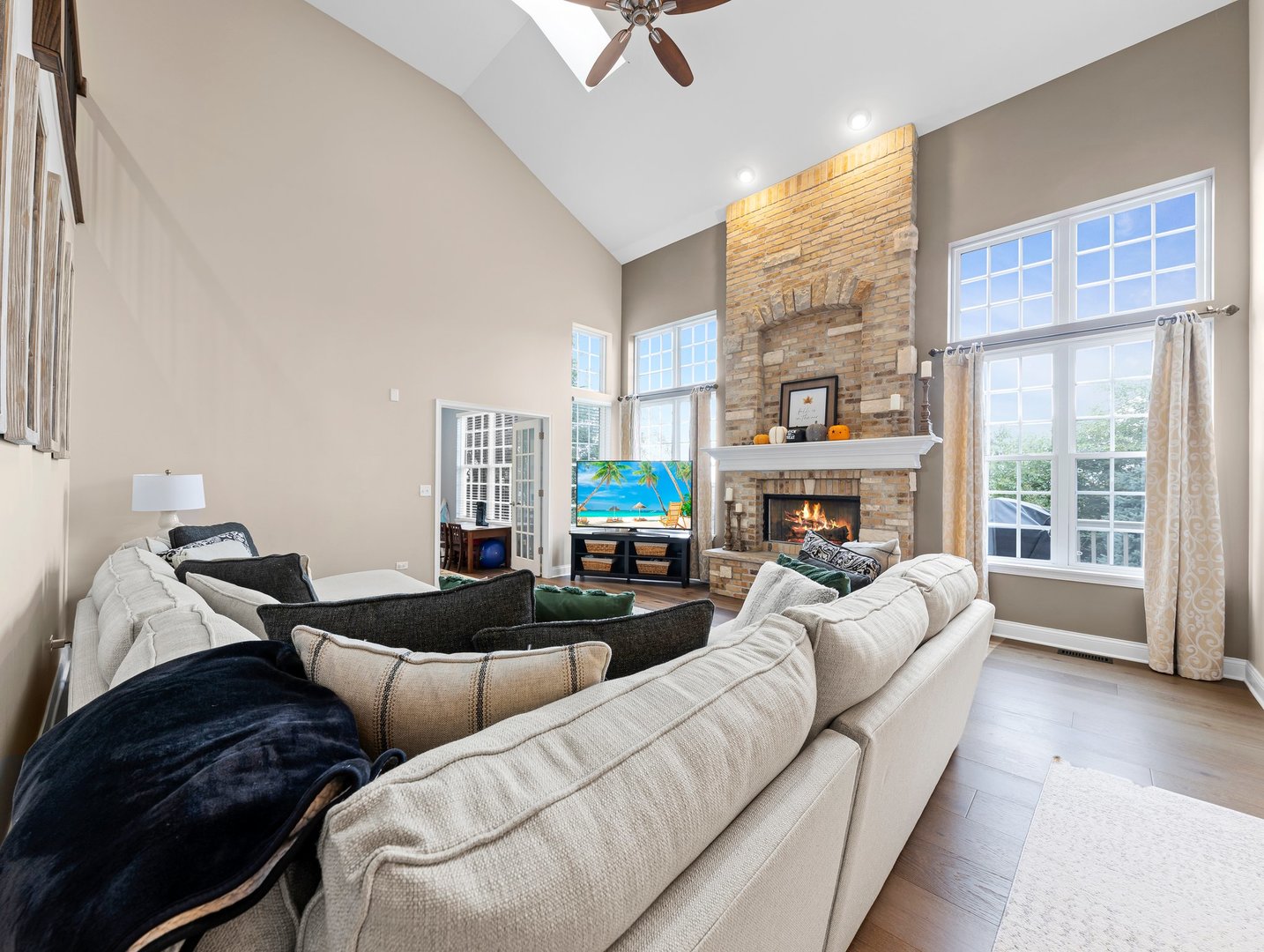26305 Mapleview Drive Plainfield, IL 60585 - Photo 14 of 40 a living room with furniture large window and a fireplace
