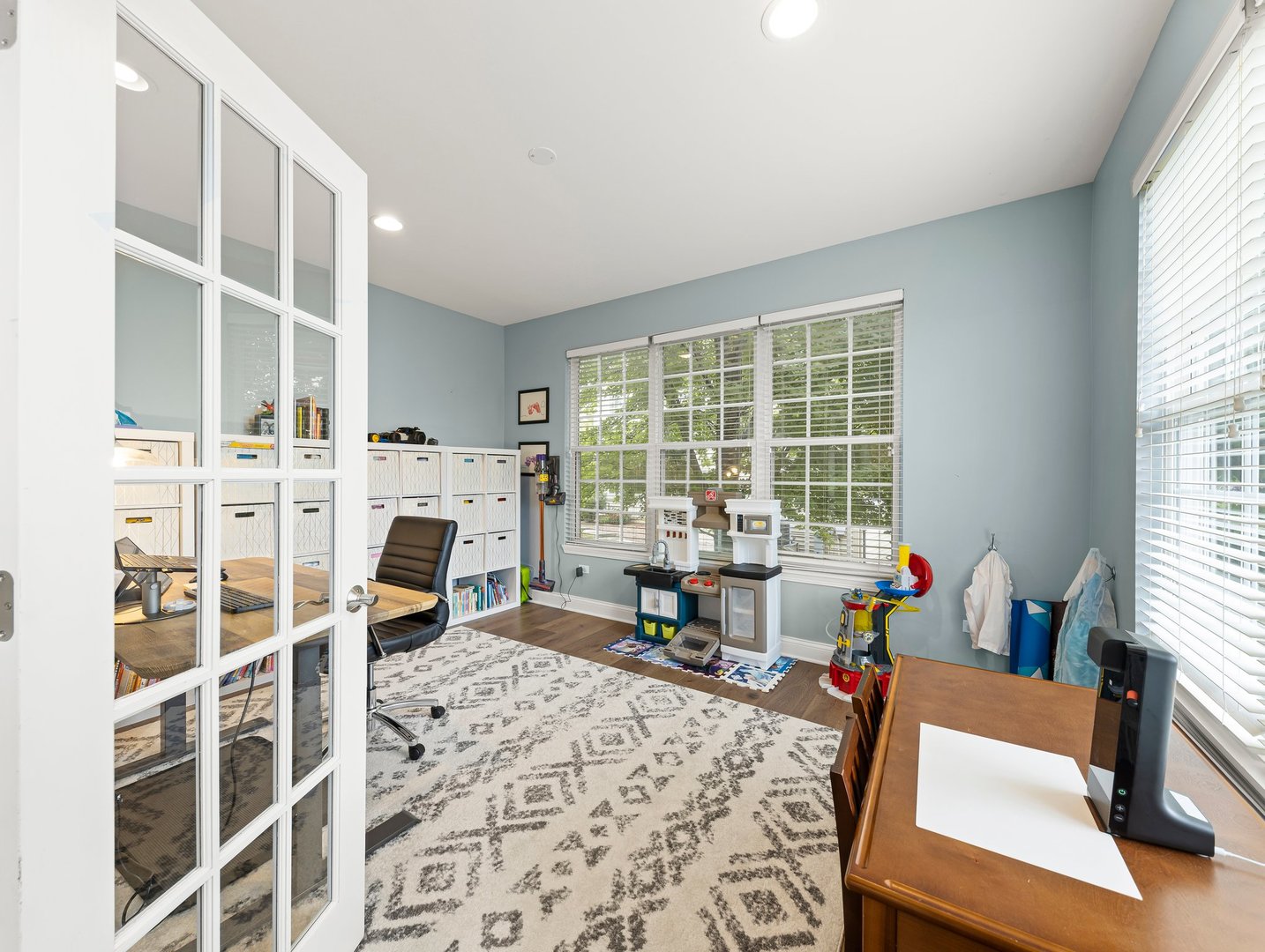 26305 Mapleview Drive Plainfield, IL 60585 - Photo 16 of 40 a living room with furniture a fireplace and large windows