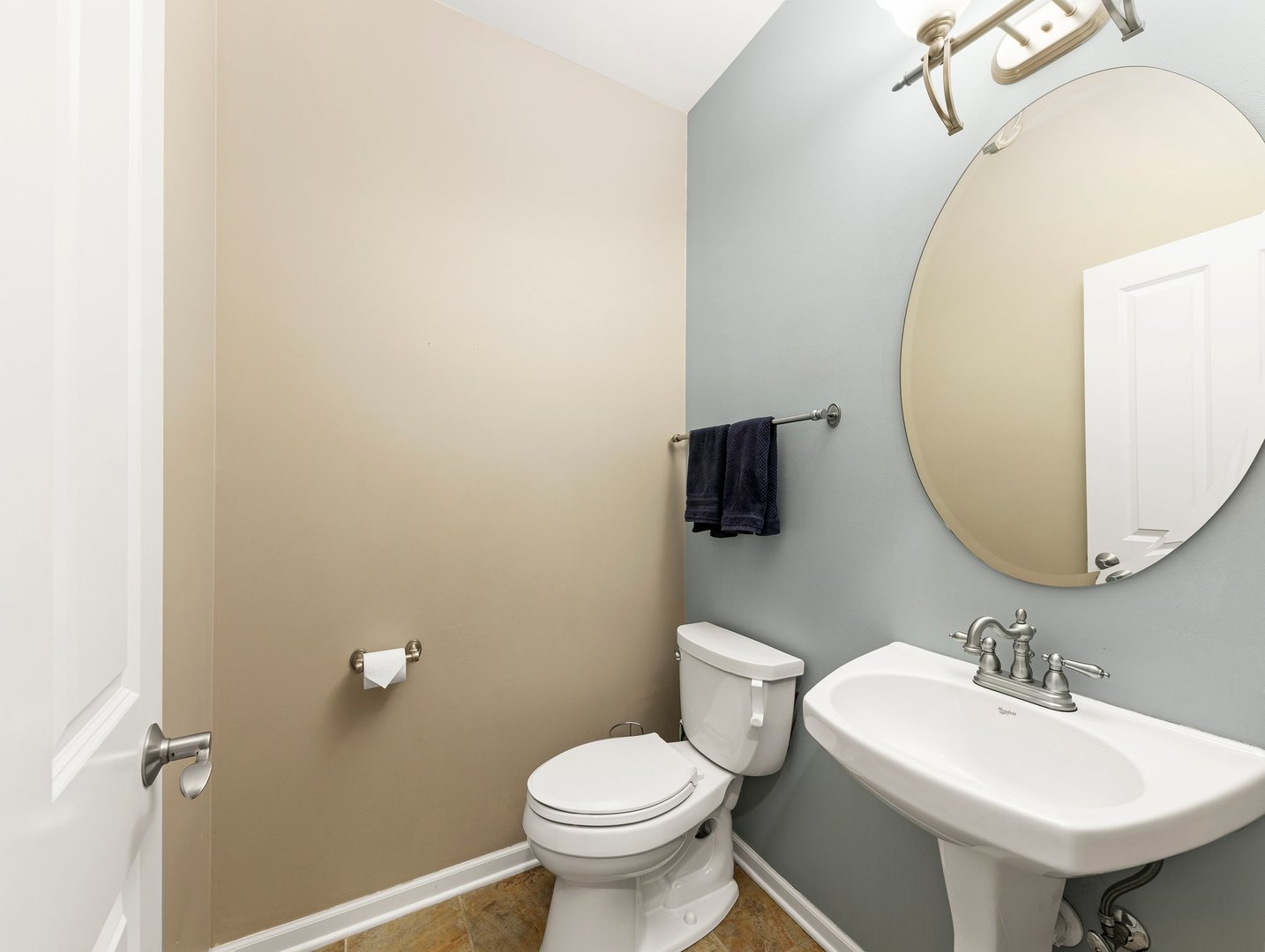 26305 Mapleview Drive Plainfield, IL 60585 - Photo 17 of 40 a bathroom with a toilet sink and mirror